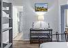 The guest bedroom features a private bathroom for convenience.