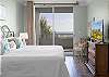 Relax and unwind in your gulf front bedroom oasis featuring king bedding, a television, and also balcony access.