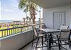 The spacious balcony features a table with seating for 4, and is a great space for enjoying meals or your morning cup of coffee.