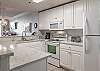 The kitchen features both small and large appliances and is fully stocked with all items needed for prepping and cooking meals during your stay.