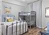 The guest bedroom can easily sleep a small family with the Queen bed and set of twin bunk beds.
