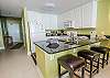The kitchen offers both small and large appliances and is fully stocked with items for meal prepping