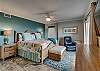 The master bedroom with views of Little Lagoon offers king bedding