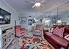 The open living area offers plenty of seating and is open to the dining area 