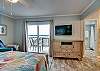 The master bedroom with Little Lagoon views offers king bedding and a private master bathroom