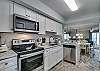The open kitchen offers all you need for preparing meals during your stay. Appliances include a refrigerator with ice maker, an electric stove with smooth cook top, a built in microwave and dishwasher. Also featured are small appliances which include a blender, toaster and automatic drip coffee pot.