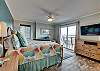 The master bedroom with little lagoon views offers king bedding, 2 bedside tables with lamps, a dresser for storing your personal items and a mounted flat screen television. This beautiful master suite also features a private master bathroom