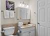 The guest bathroom features a single vanity, tub/shower combo, and is fully stocked with linens for your stay.