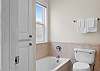 The private bathroom offers a large soaking tub, a separate shower, single vanity, and is fully stocked with linens for your stay.