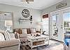 The spacious living area features plenty of comfortable seating which includes a sofa sleeper for additional, overnight guests. Double doors take you to the large balcony where you can relax and enjoy the coastal breeze.