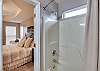 The private master bathroom offers a tub/shower combo