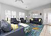 This spacious and comfortable living area features new furniture, including a sofa sleeper for additional, overnight guests. 