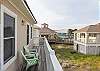 A balcony is featured on the back of the home and offers a great view of the community pool.