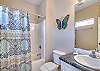 Bathroom 1 offers a single vanity, a tub/shower combo, and is fully stocked with linens for your stay.