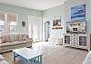 This spacious living area features plenty of comfortable seating and a large television for relaxing and enjoying your down time.