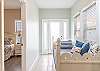 A Twin Daybed with trundle is provided in the open hallway located outside the Primary bedroom offering a great space for additional, overnight guests.