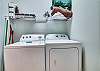 The laundry room offers a full size washer and dryer for your convenience.