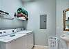 This multi-functional space offers a full size washer and dryer, and also provides a sink and toilet for convenience.