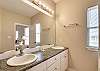 Bathroom 4 features a double vanity, and is fully stocked with linens for your stay.