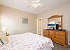 Guest bedroom 2 features a private bathroom, plenty of space for your personal belongings to be stored out of sight, and a television to help you unwind at night.