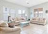 The open living area features plenty of seating with sofa sleepers provided for additional, overnight guests.
