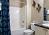 Each bedroom features a private bathroom for convenience. This bathroom features a tub/shower combo, single vanity, and is fully stocked with linens for your stay.