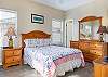 This guest bedroom is located at the front of the home and features a private bathroom. Fully furnished and offers plenty of space for storing your personal belongings.