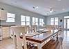The dining area that joins with the kitchen offers a large table with seating for 6-7. Along with the 4 chairs, a nice bench seat is offered.