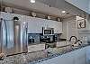 The spacious kitchen offers beautiful granite countertops and stainless appliances