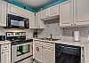 A dishwasher, electric range stove and built in microwave are included in the appliance package this great unit offers. The cabinets are fully stocked with all items needed for meal prepping.