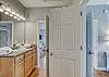 The guest bathroom can be accessed from the living/dining area and also offers private access from the guest bedroom with queen bedding.
