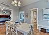 A table with seating for 4 in chairs and a great bench is provided in the dining area