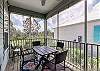 The screen porch offers a table with seating for 4. Extra chairs are provided as well