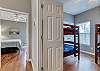 Guest Bedroom 2 is offered just off the dining area and features 2 twin over twin sets of bunk beds.