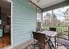 The screen porch offers a table with seating for 4. A great space for enjoying your morning coffee or maybe an evening cocktail