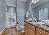 The guest bathroom is located between both guest bedrooms and is accessed from the living/dining area