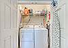 A laundry closet is provided in the kitchen which includes a full size washer and dryer for use during your stay