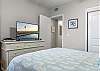 The spacious guest bedroom features Queen bedding, plenty of storage for your personal belongings, and a television to help you unwind at night.
