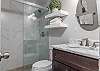 The private bathroom features plenty a single vanity, tiled shower, and is fully stocked with linens for your stay.