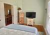 A small chest of drawers and television is offered in Bedroom 3.