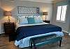 The spacious primary bedroom features King bedding, and is beautifully furnished to make you feel right at home.
