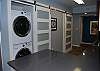 The kitchen area offers a stack washer dryer for your convenience.