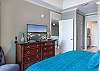 The primary bedroom features a private on-suite and a large walk-in closet.