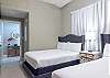 Bedroom 2 features a pair of Queen beds and private access to the guest bathroom for convenience.
