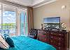A television is featured in the primary bedroom as well as ample storage for your personal belongings.