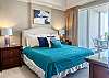 The primary bedroom features balcony access and King bedding.