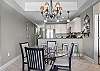 The spacious kitchen and open dining area offers plenty of seating for every member of your group.