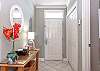 The entryway features a laundry closet with a stack washer/dryer for use during your stay.