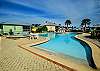 The main pool, which features a small clubhouse with restroom, offers a relaxing retreat for spending a day in the sun.