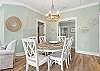 The center of the cottage offers a spacious dining area that provides a table with seating for 6. This space is perfect for enjoying meals and spending quality time together.